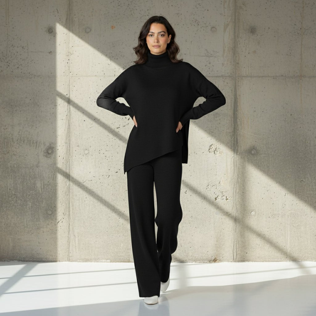 Woman wearing a black outfit on a gray background