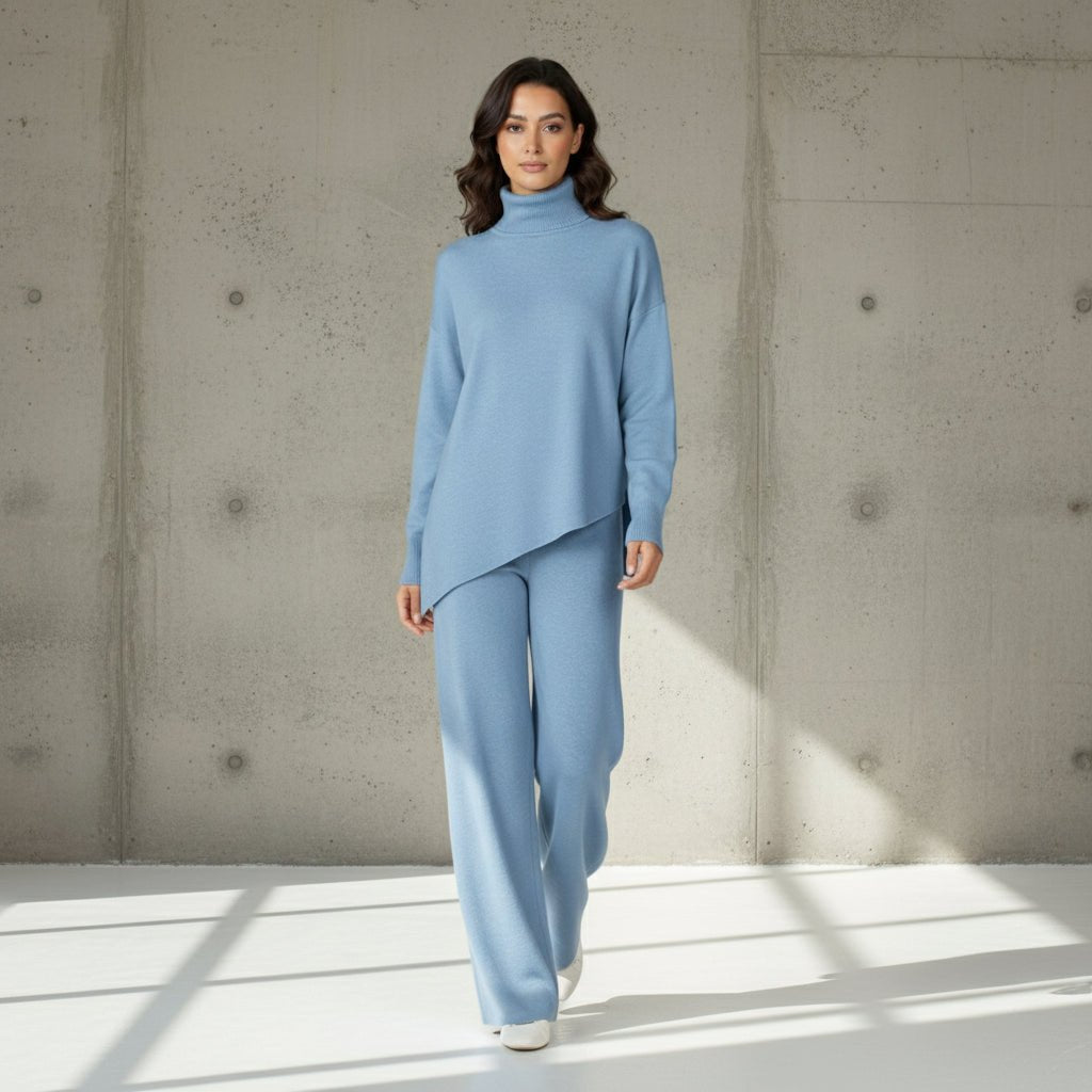 Woman wearing a light blue outfit on a gray background