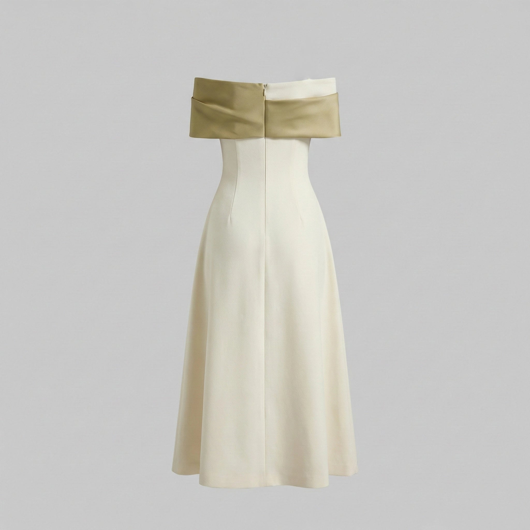 Beige strapless dress with gold waistband on a light gray background