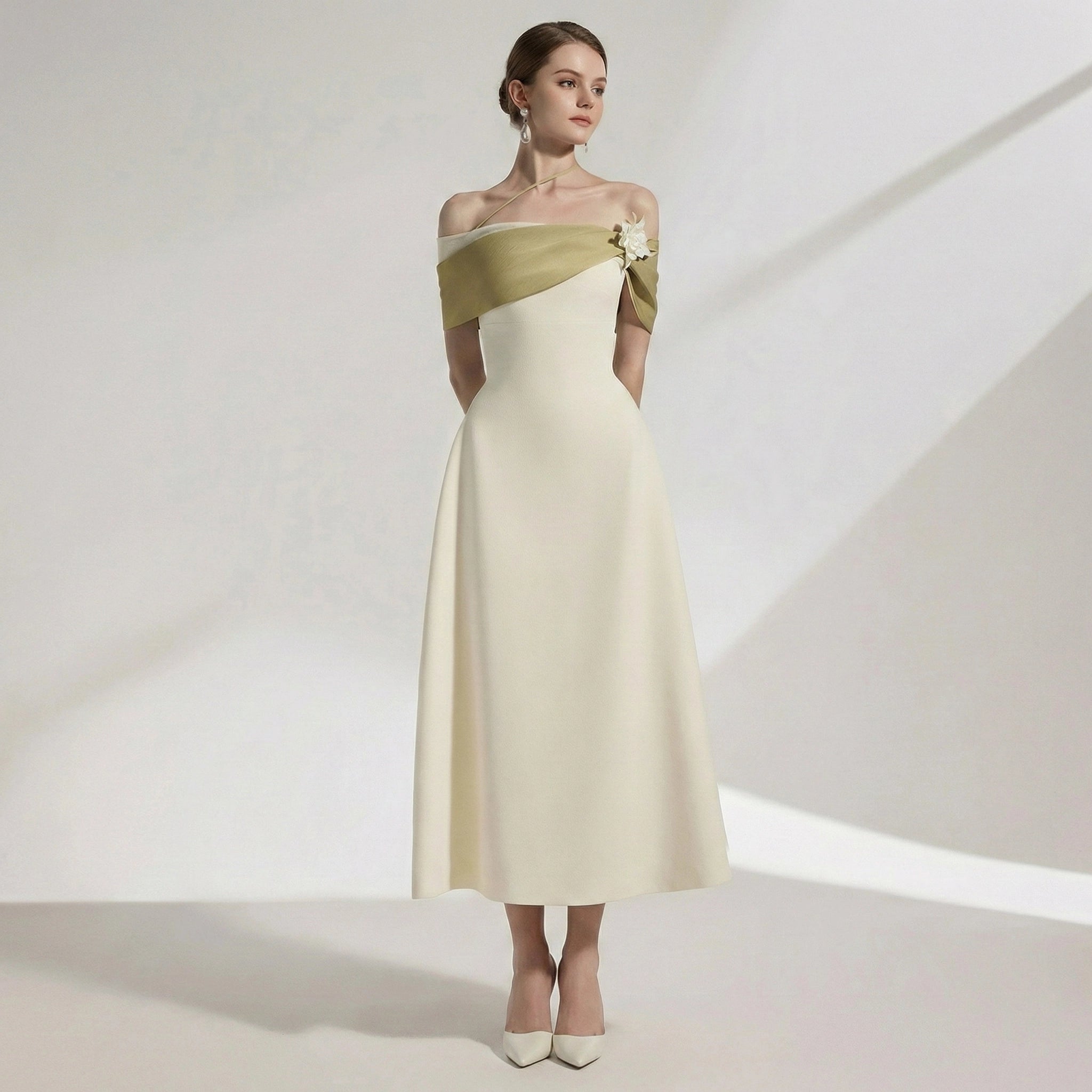 Woman wearing a two-tone off-shoulder dress on a white background