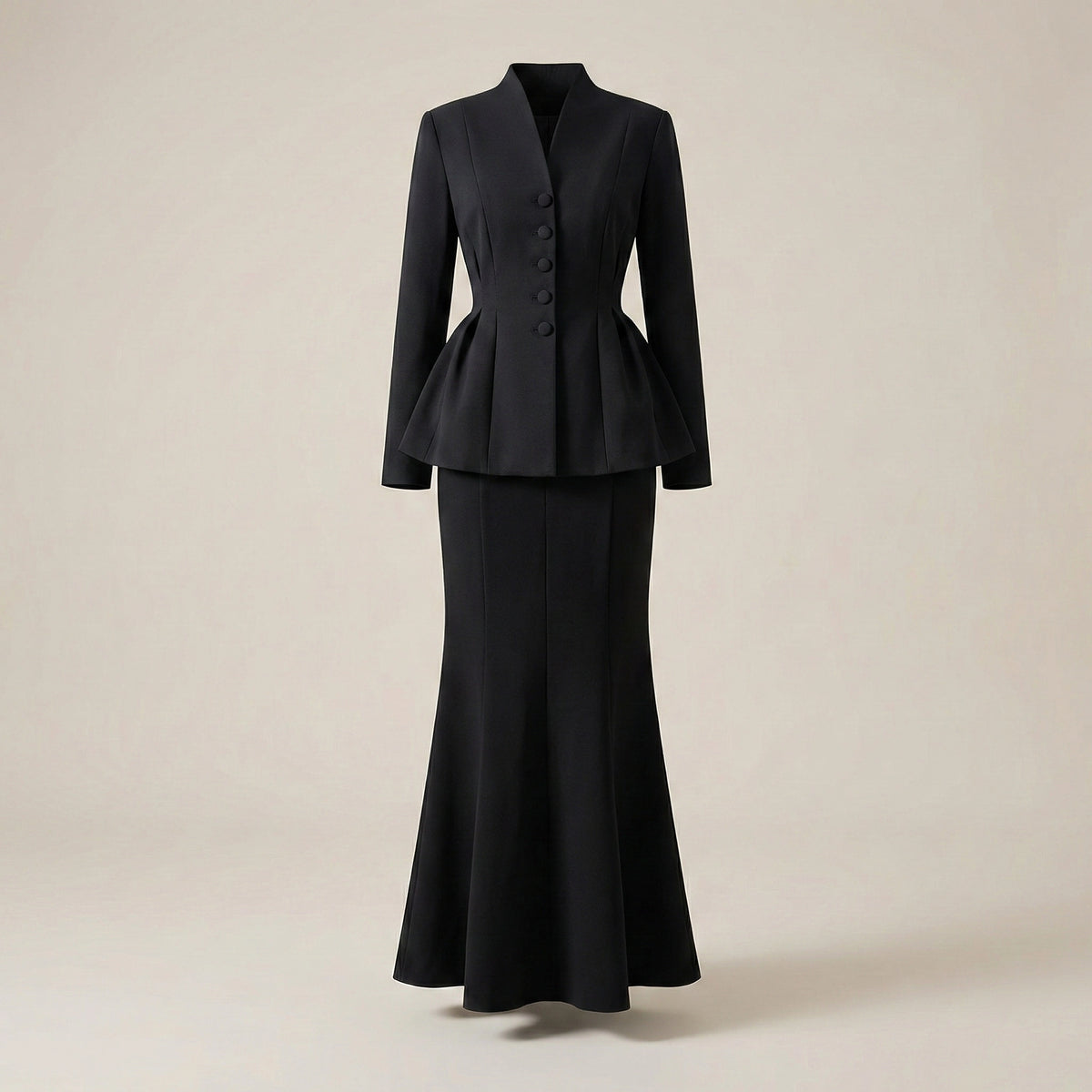 Black suit with peplum top on a beige background