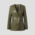 Green leather blazer on a light gray background
