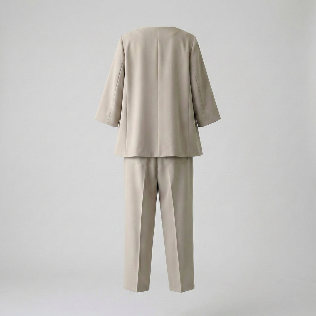 Beige suit with jacket and pants on a light gray background