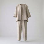 Beige suit with jacket and pants on a light gray background