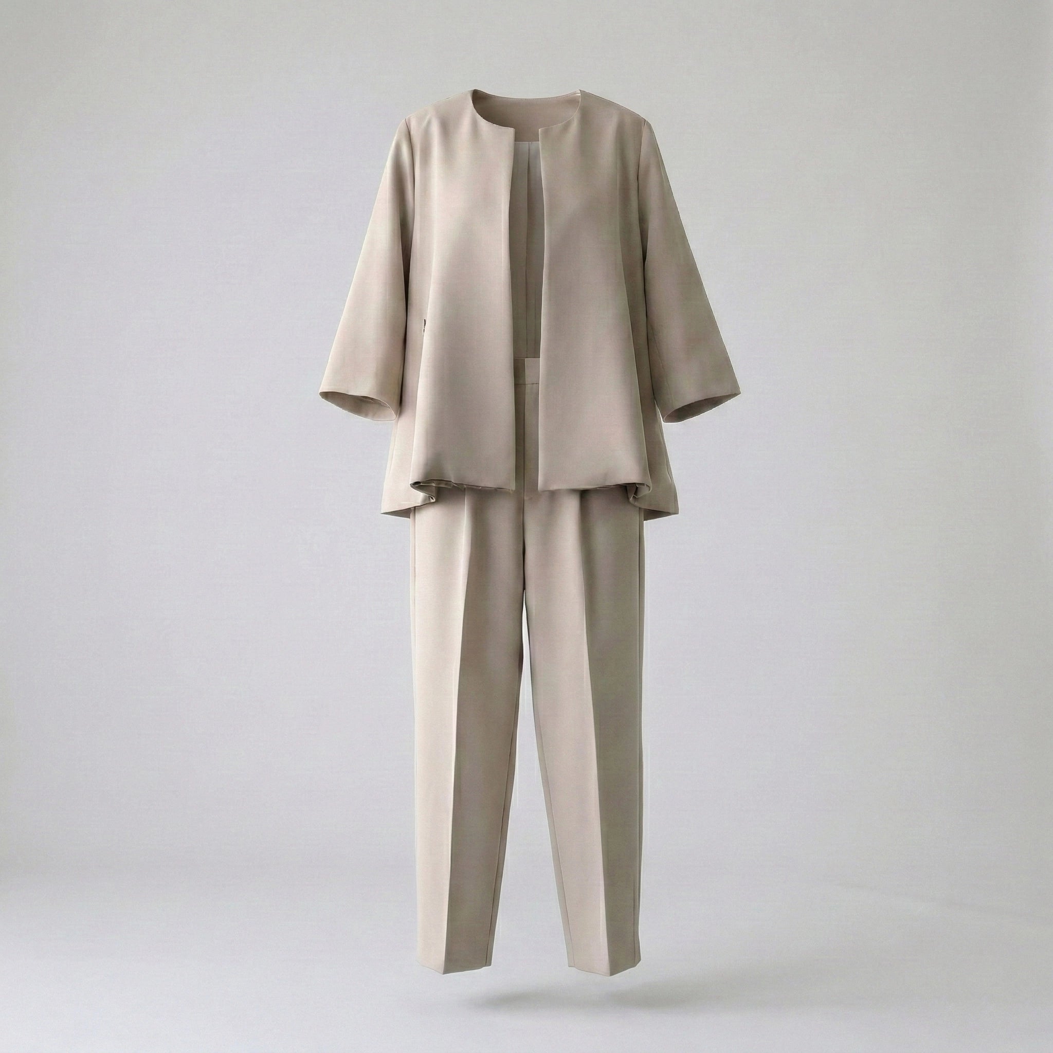Beige suit with jacket and pants on a light gray background