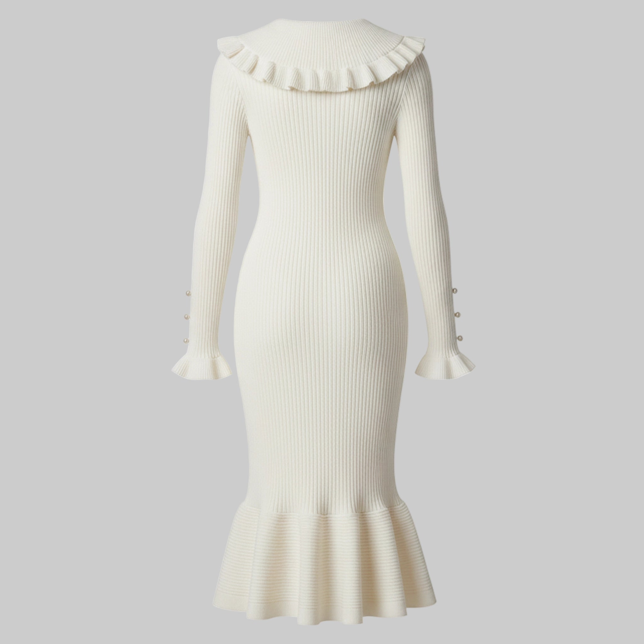 White ribbed dress with ruffled collar and hem on a white background