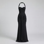 Black evening gown on a light gray background