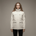Woman wearing a beige jacket against a plain background