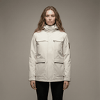 Woman wearing a beige jacket against a plain background