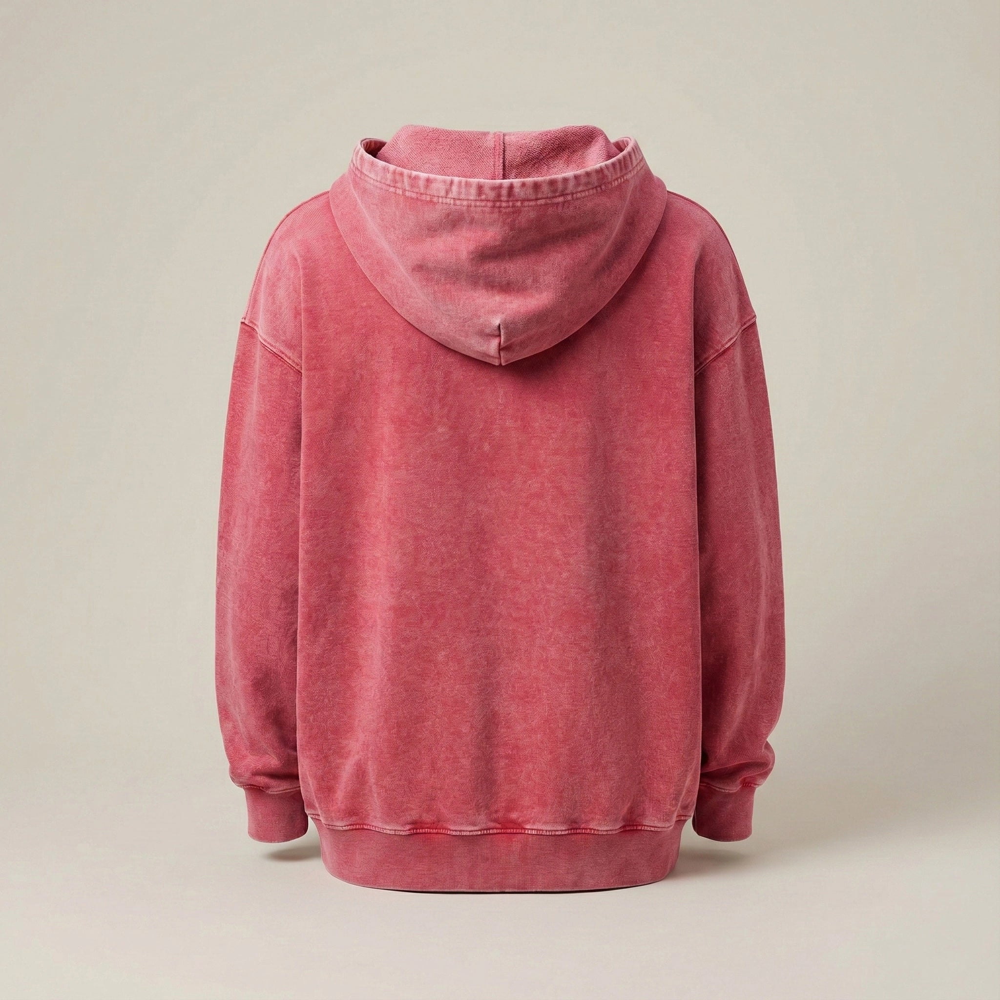 Pink hoodie on a beige background