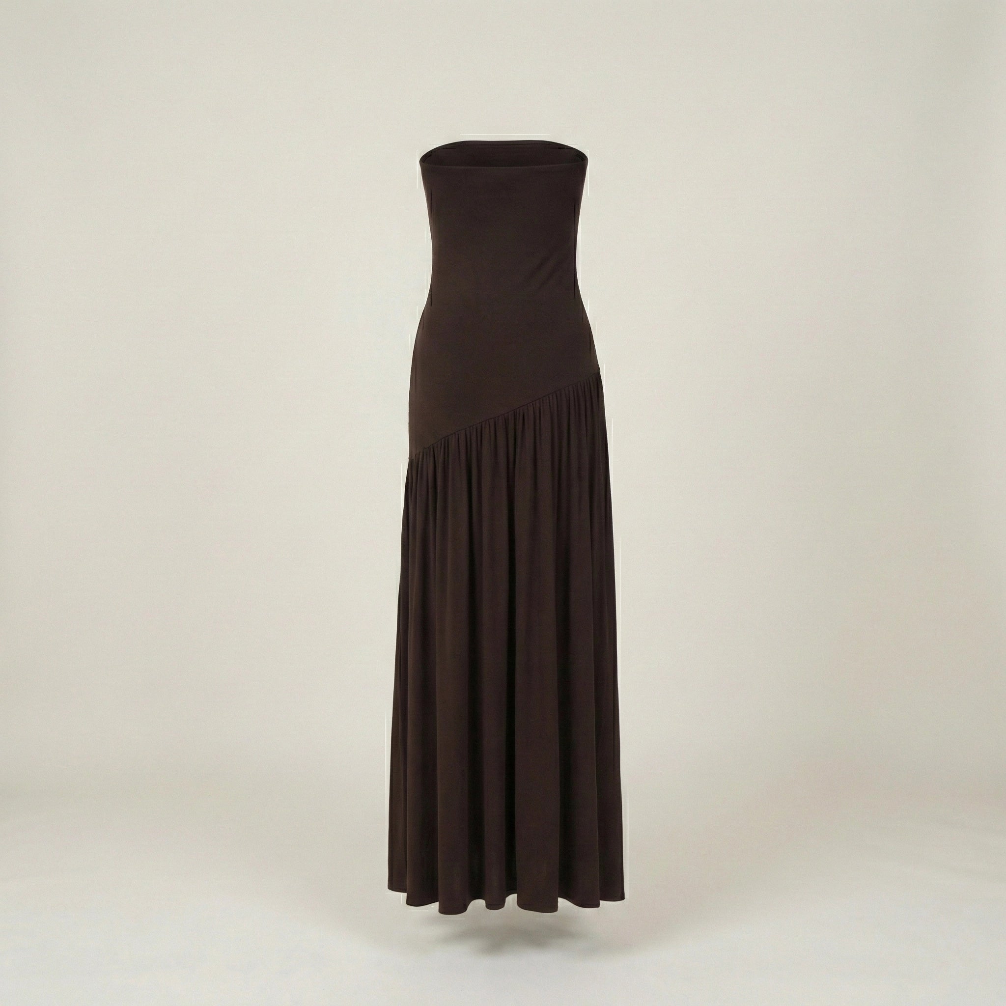 Brown strapless dress on a light beige background