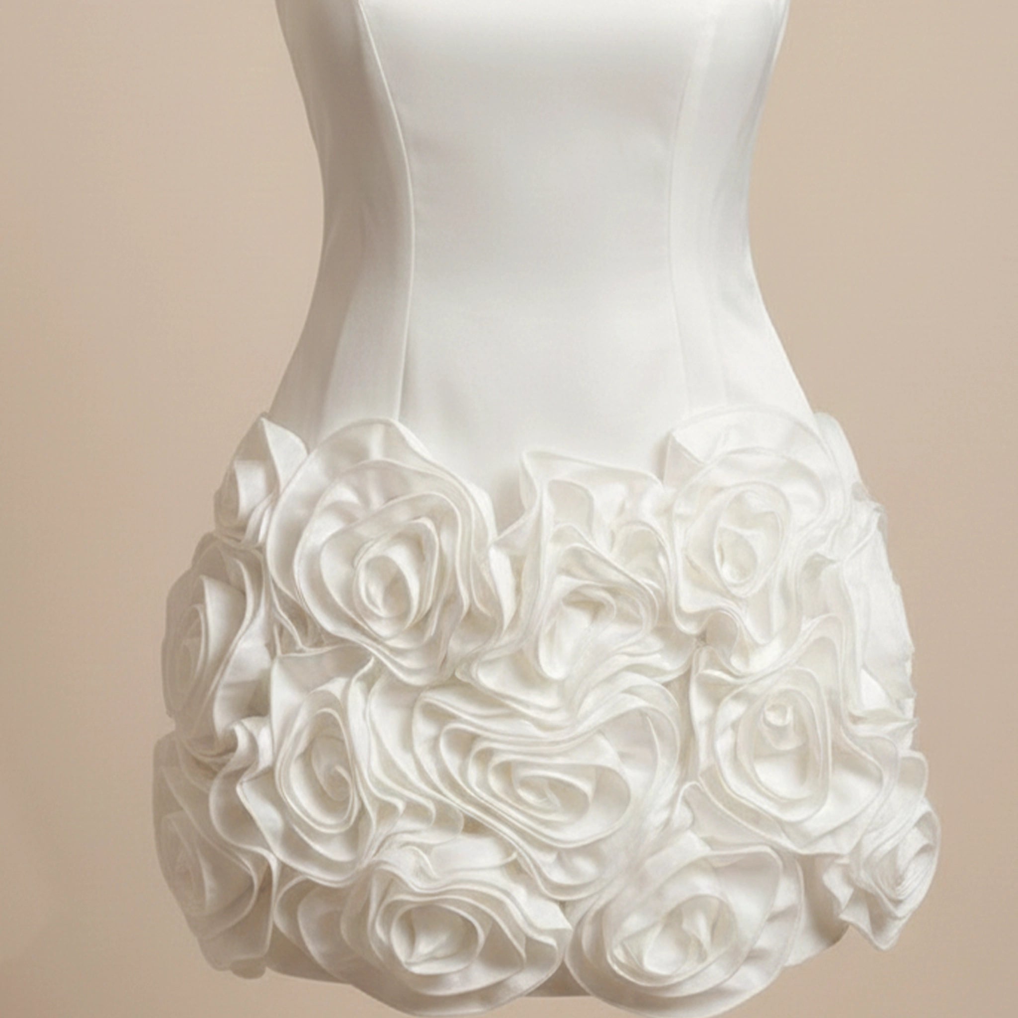 White wedding dress with floral details on a beige background