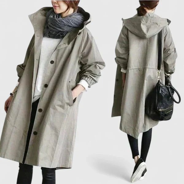 Long gray coat worn by a person on a white background