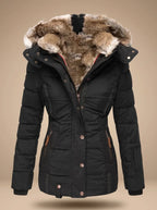 A black puffer jacket with a plush brown and beige faux-fur trimmed hood, displayed on a neutral beige background.