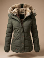 An olive green puffer jacket with a plush brown and beige faux-fur trimmed hood, displayed on a neutral beige background.