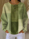 Green textured shirt worn by a person with a neutral background