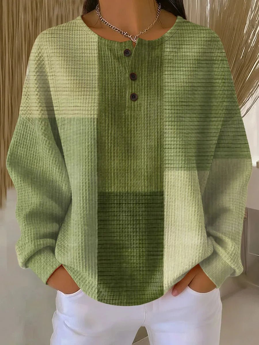 Green textured shirt worn by a person with a neutral background