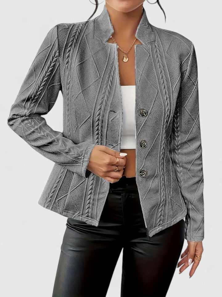 Gray textured jacket worn by a person on a white background