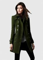 Woman wearing a green coat on a white background