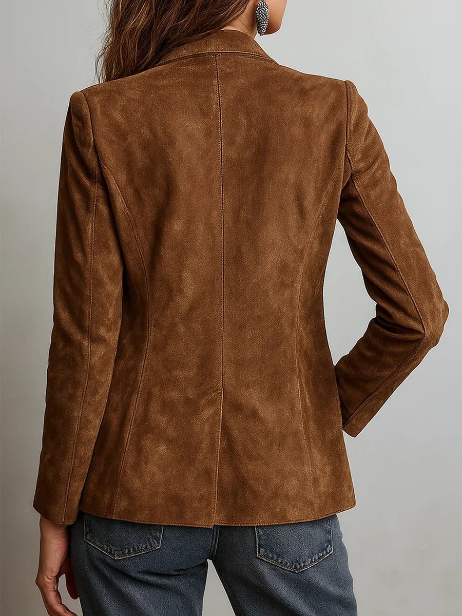 Brown suede jacket worn by a person on a plain background