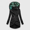 Black hooded jacket with tropical leaf pattern lining on a light gray background