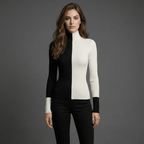 Woman wearing a black and white outfit against a gray background