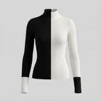 Black and white ribbed sweater on a light gray background