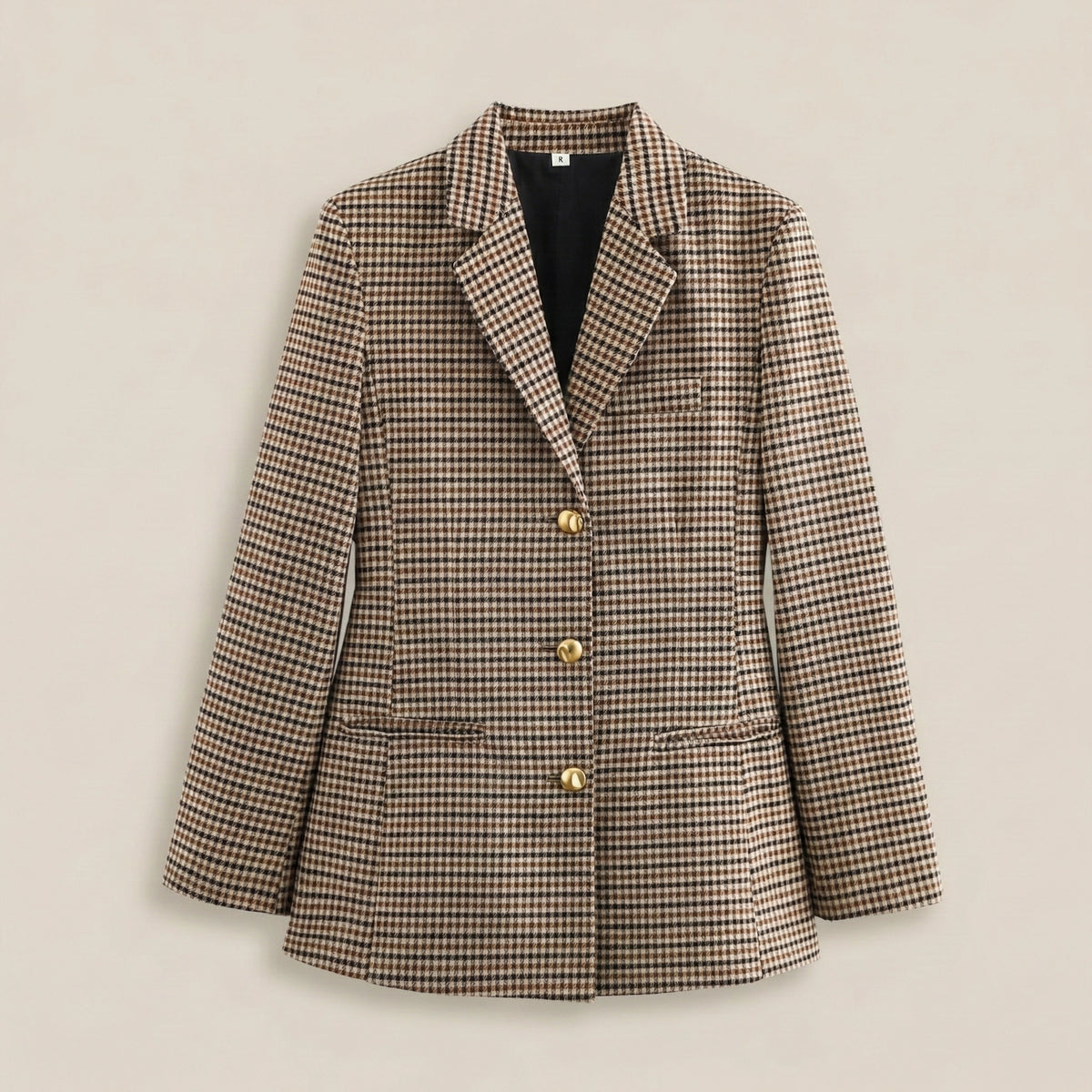 Plaid blazer with gold buttons on a beige background