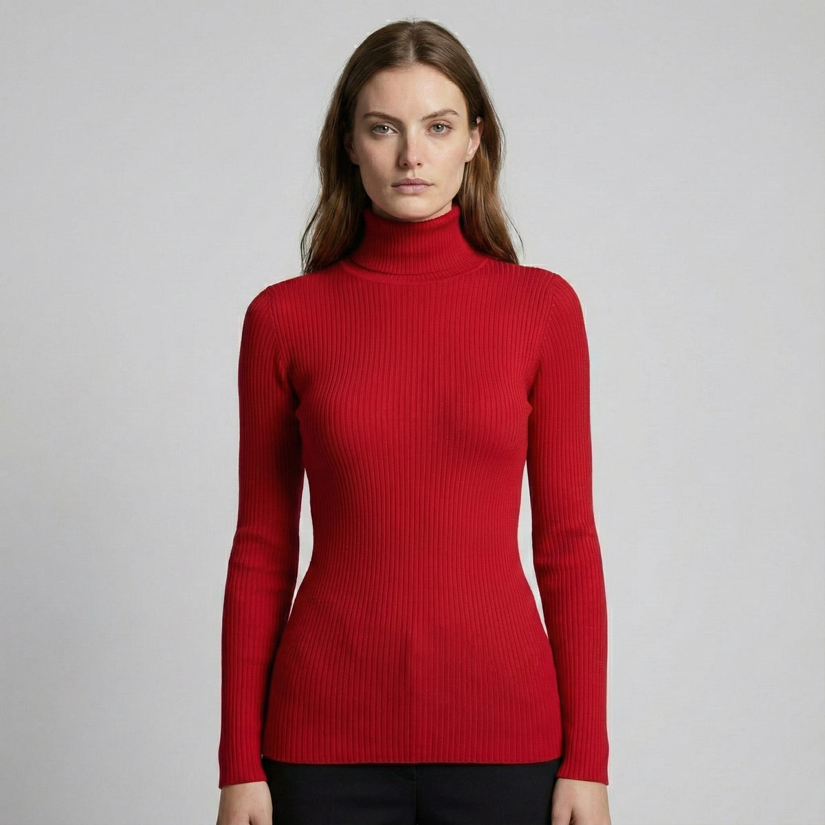 Woman wearing a red turtleneck sweater on a gray background