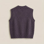 Purple knitted vest on a beige background