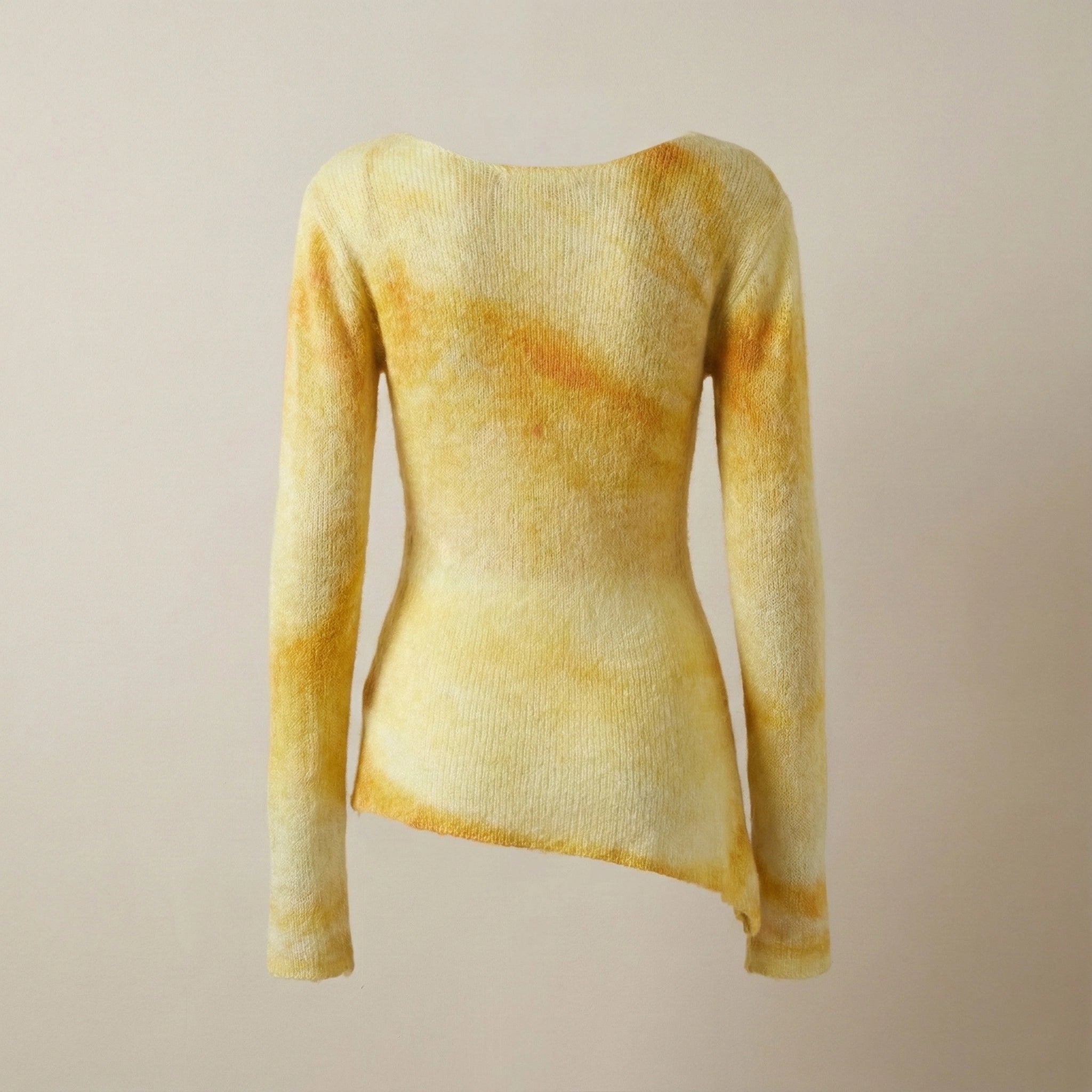 Yellow sweater on a beige background