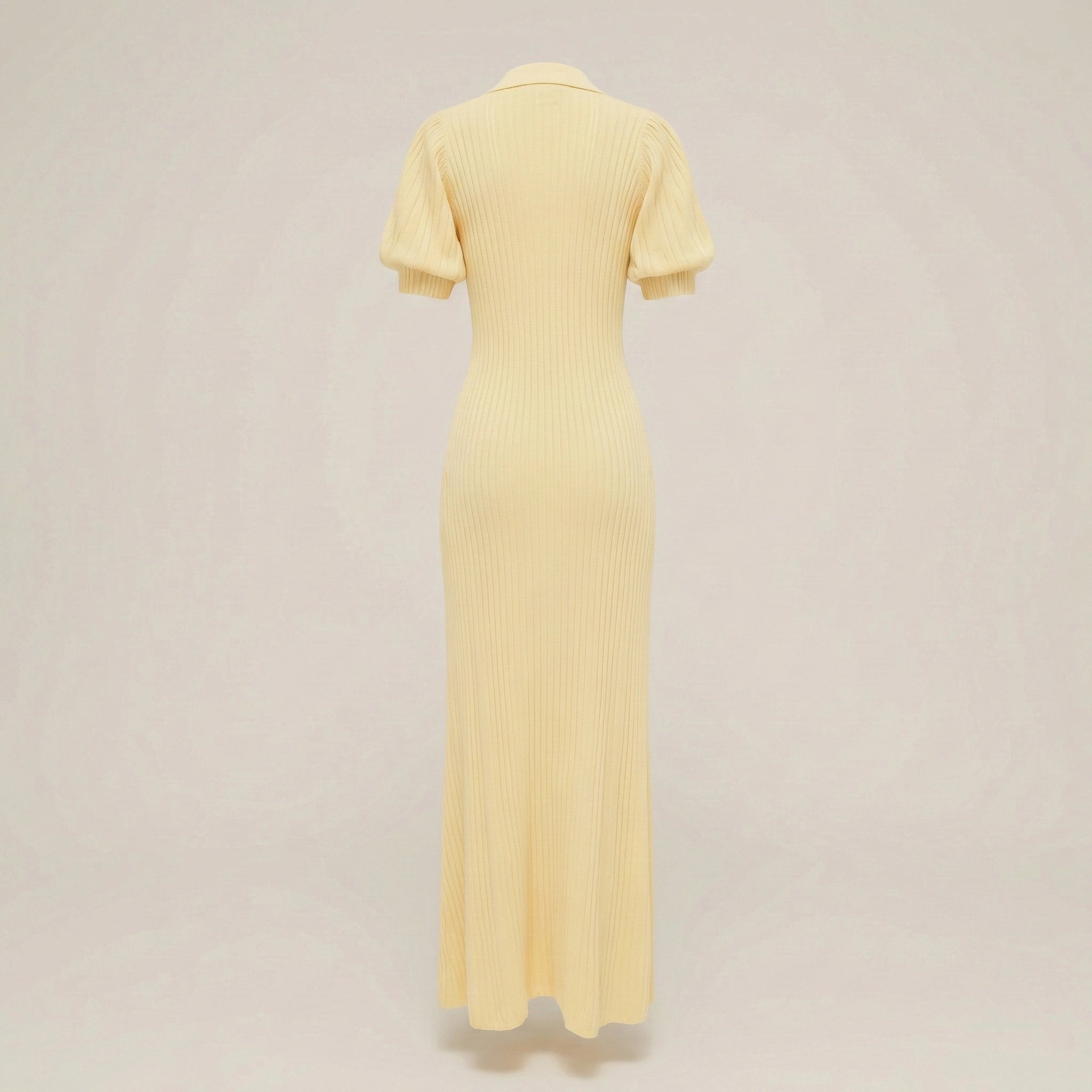 Yellow dress on a beige background