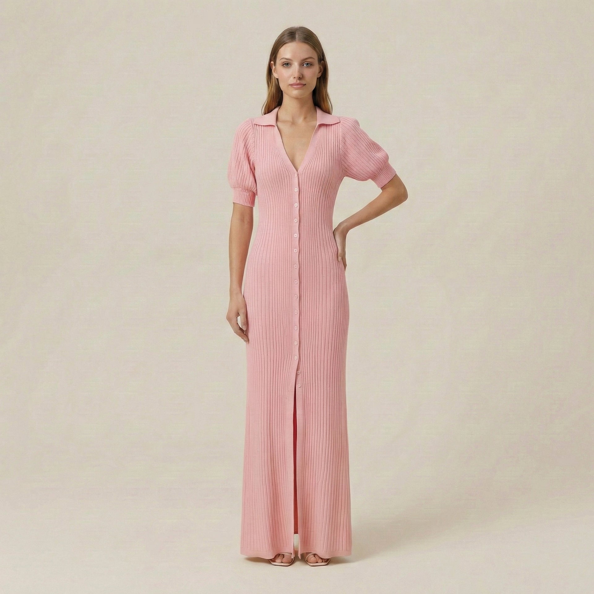 Woman wearing a pink dress with short sleeves on a beige background