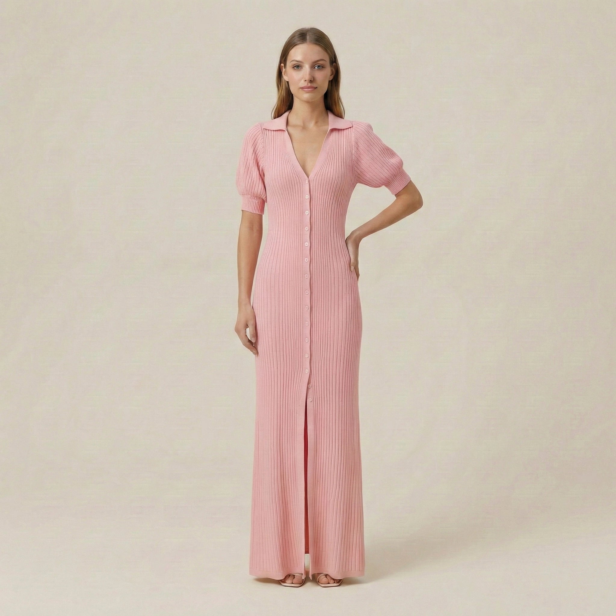 Woman wearing a pink dress with short sleeves on a beige background