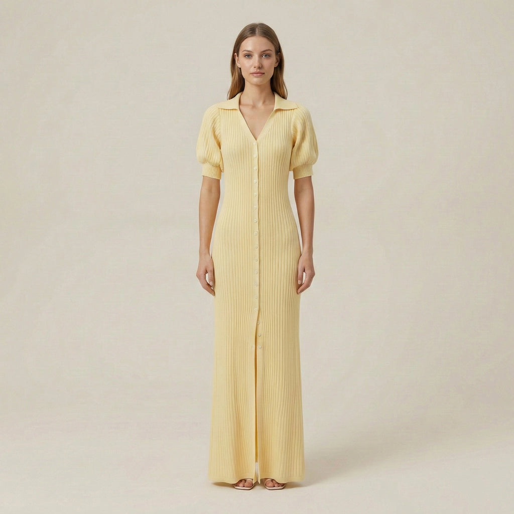 Woman wearing a yellow dress against a plain background